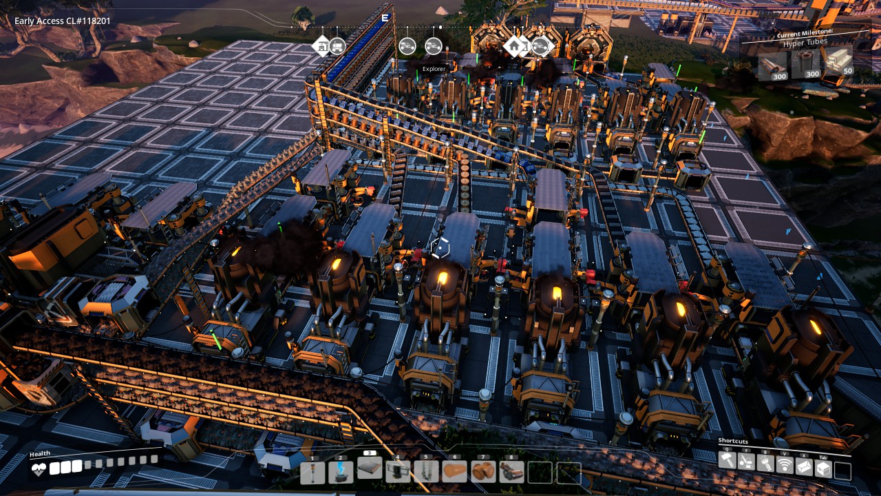 An early factory filled with production machines and conveyor belts in Satisfactory
