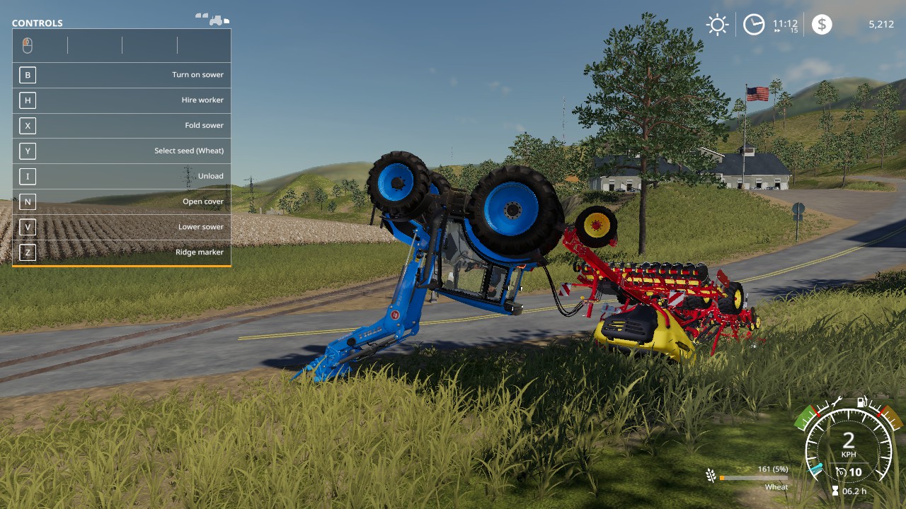 An overturned tractor and planter beside a road in Farming Simulator 19