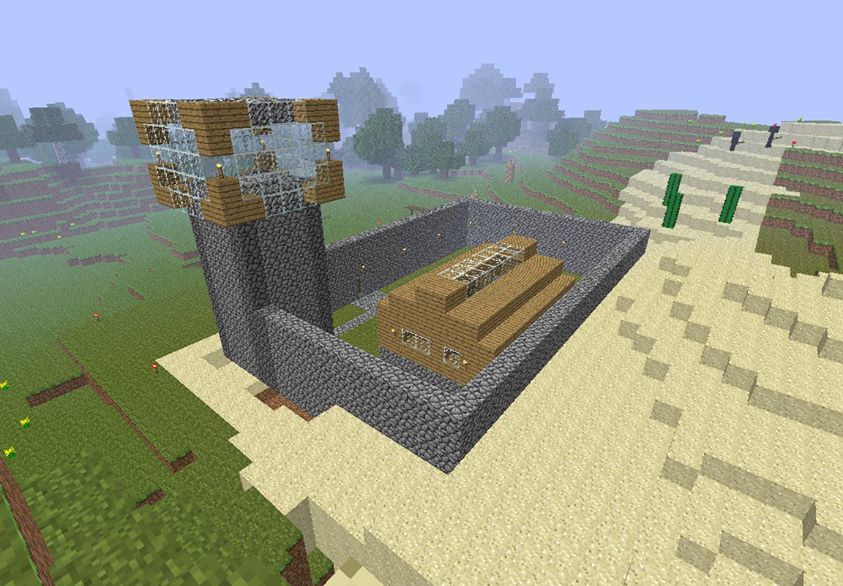 My first Minecraft creation, a small fortified wooden building with a cobblestone tower