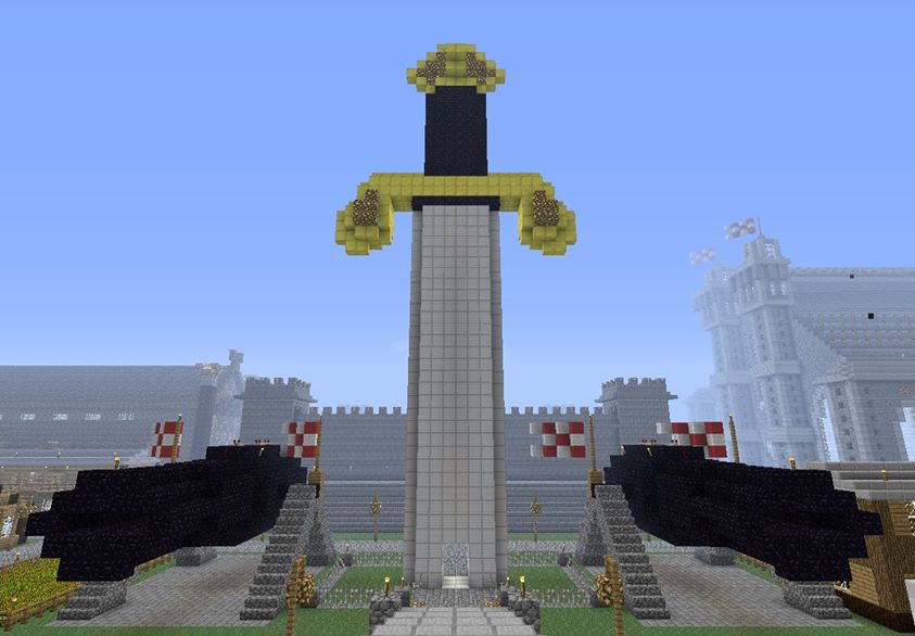 A pair of Redstone-powered obsidian cannons beside a monumental sword in Minecraft