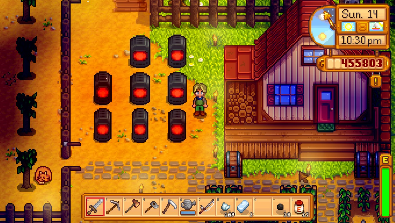 A quiet evening beside the farmhouse and glowing farm equipment in Stardew Valley